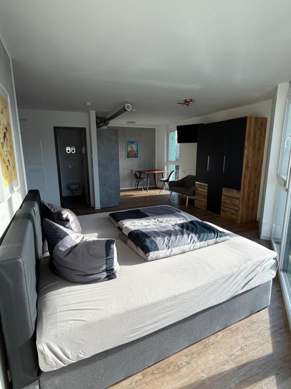 a large bed in the middle of a room at Apartmenthaus MK Immobilien in Stuttgart