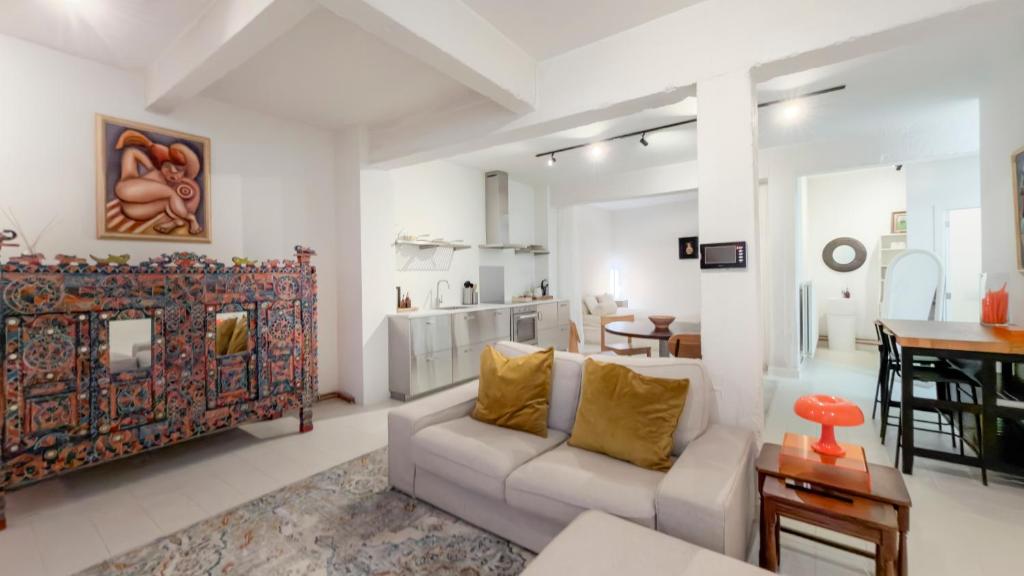 a living room with a couch and a table at Cosy loft near City Centre, Terra CasaMia in Antwerp