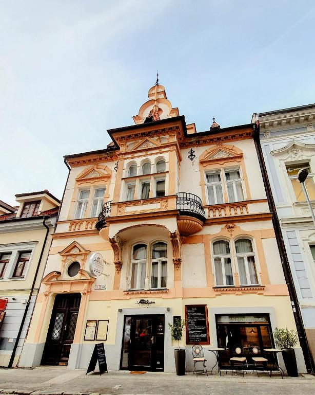 a building with a tower on top of it at Downtown Bratislava B&B in Bratislava