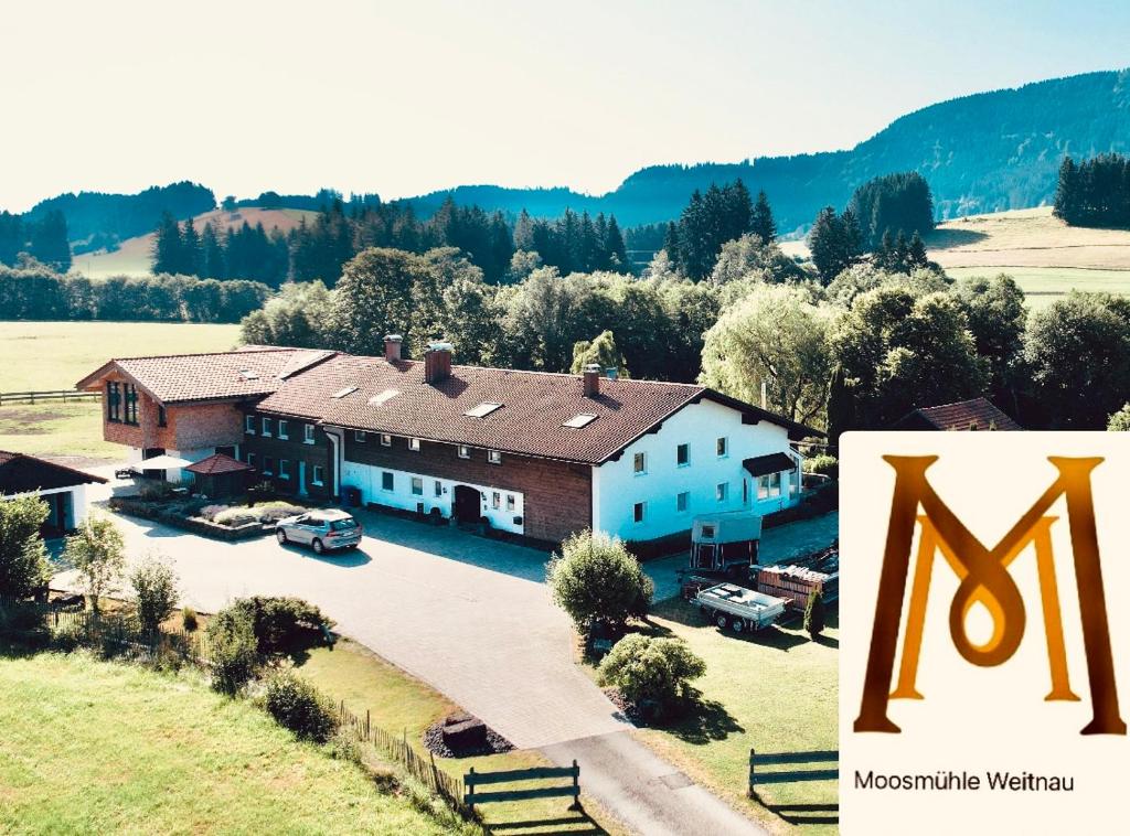 an aerial view of a house with a large yard at Moosmühle Weitnau in Weitnau