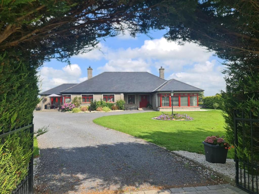 a house with a red and white house at This is the Place in Ballinrobe