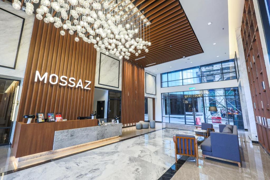 a lobby of a moxaz store with a chandelier at Mossaz Suites by Mana Mana in Petaling Jaya