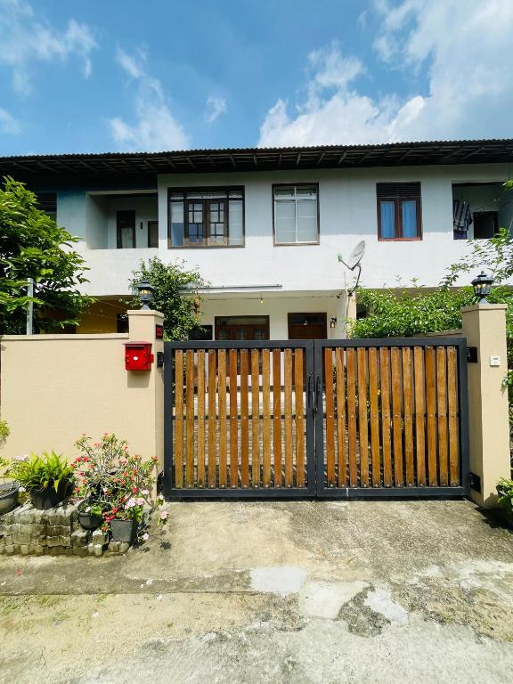 a gate in front of a house at Anu Home Stay in Ahangama