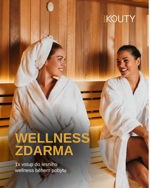a magazine cover with two women sitting in a bathtub at Hotel Kouty in Ledeč nad Sázavou