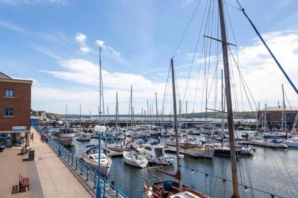 a bunch of boats docked in a harbor at Sleeps 7 in Pembrokeshire