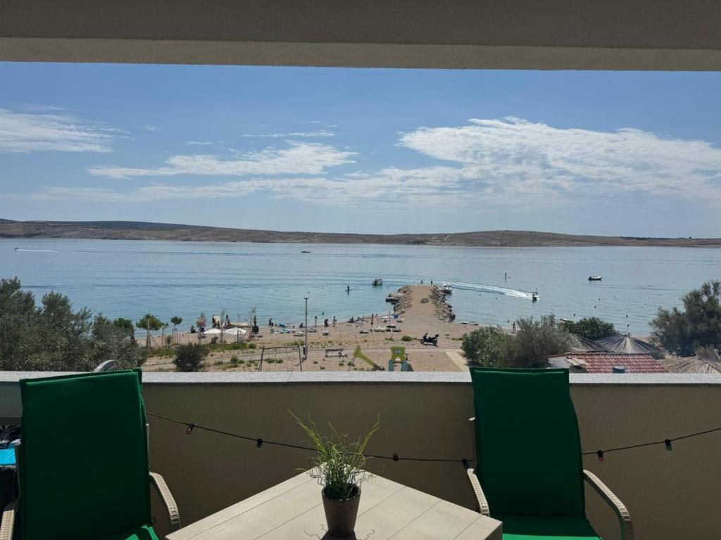 a balcony with a view of a body of water at Andreja in Kustići