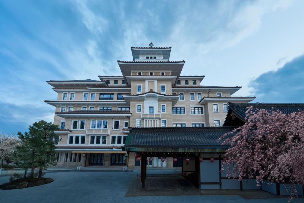 a large building with a tower on top of it at Imperial Hotel, Kyoto in Kyoto