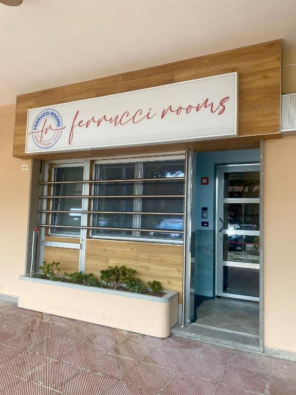 a store front with a sign for a store at Ferrucci Rooms in Marina di Cecina