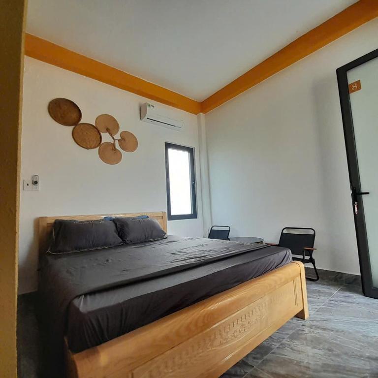 a bedroom with a large bed in a room at NT Bell Homestay in Ninh Hải