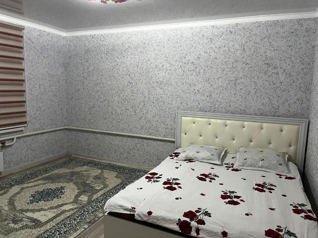 Llit o llits en una habitació de Datkaiym Guest House