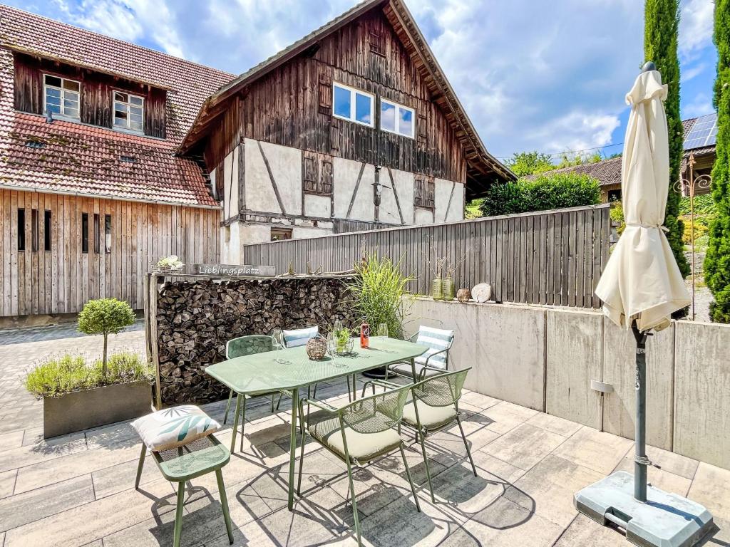 a patio with a table and chairs and a fence at Apartment Kinast - HFT202 by Interhome in Hofstetten