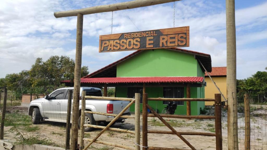 a truck parked in front of a gas station at casa passos e reis in Corumbau