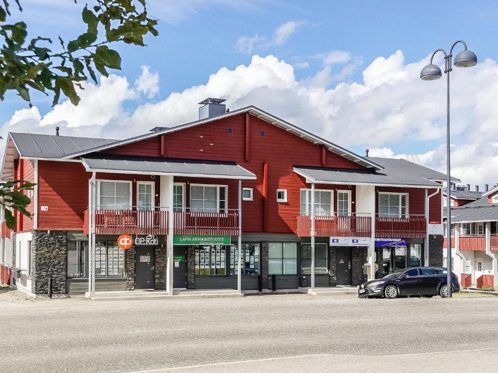 a red building on the side of a street at Holiday Home Levi star 2- as- 409 by Interhome in Levi