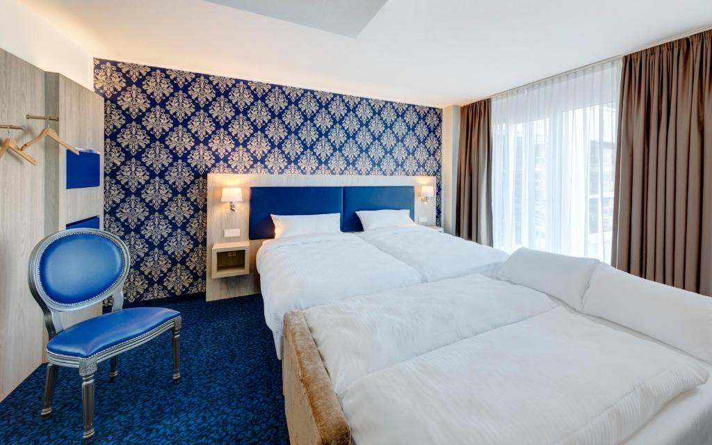 Ein Bett oder Betten in einem Zimmer der Unterkunft ibis Styles Rastatt Baden-Baden