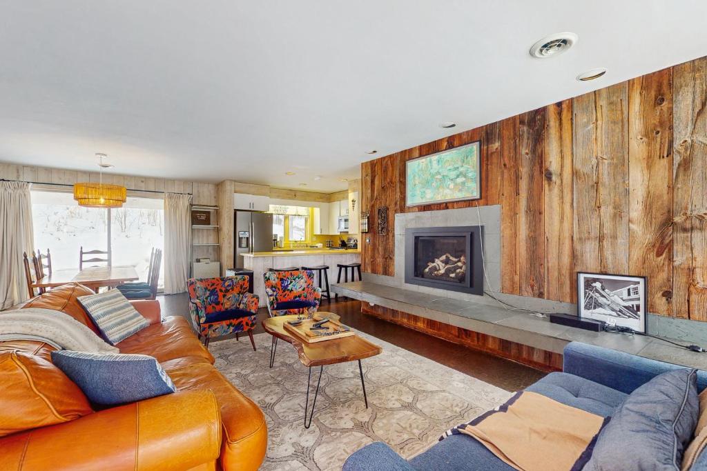 a living room with a couch and a fireplace at Fawn Ledge in Jamaica