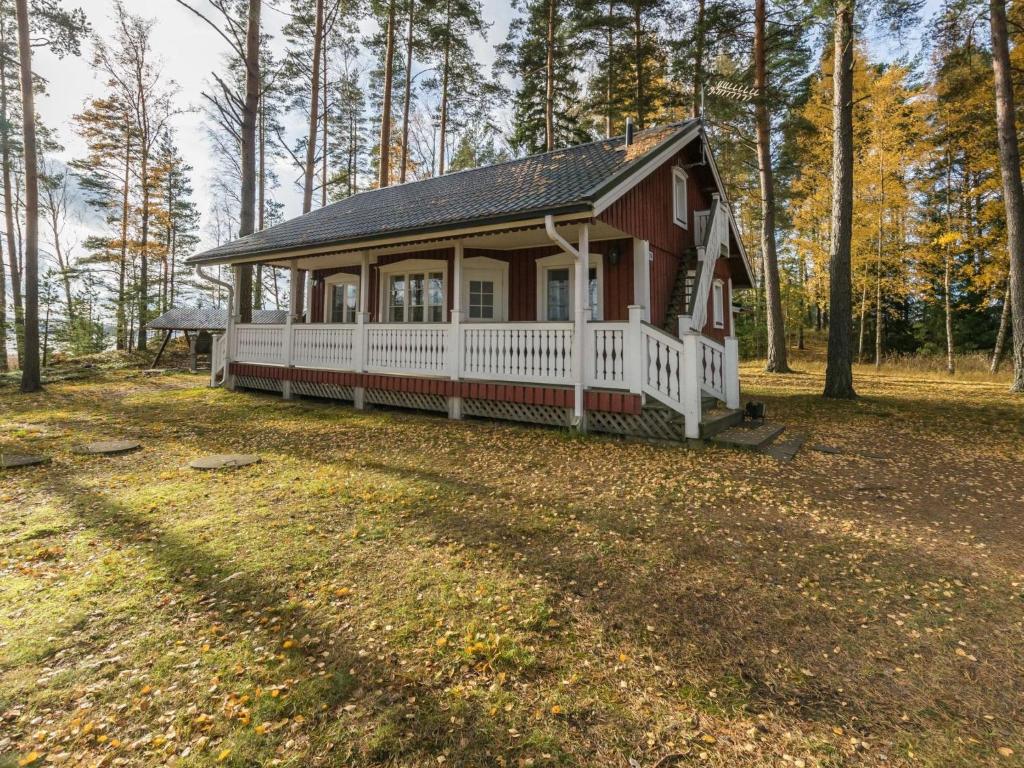 a small house in the middle of a forest at Holiday Home Meritähti by Interhome in Matildedal