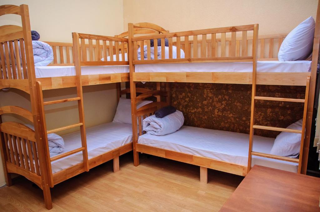 Postel nebo postele na pokoji v ubytování Golden Globus Hostel