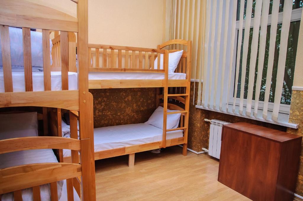 Postel nebo postele na pokoji v ubytování Golden Globus Hostel