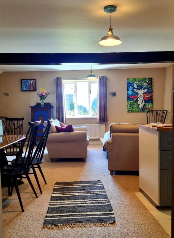 a living room with a couch and a table at Horse & Farrier Pub in Dacre