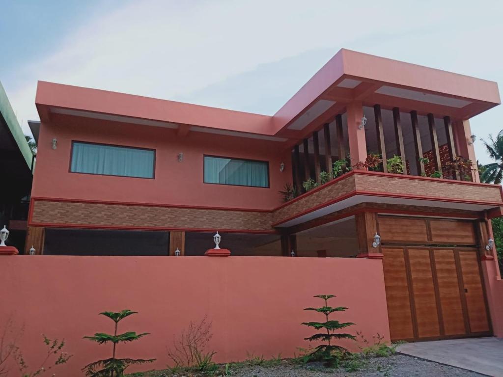 a house with a balcony on top of it at Jarens Diner in Silang