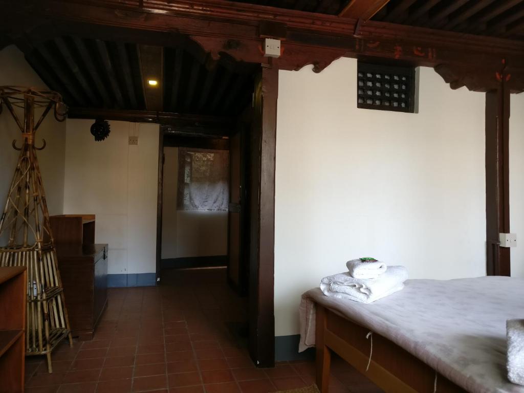Postel nebo postele na pokoji v ubytování Hiranya Guest House