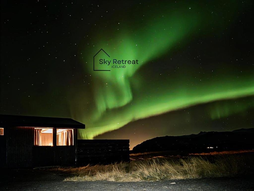 an image of the sky retreat hotel under the aurora at Aurora Cabin and Private Jacuzzi in Hvolsvöllur