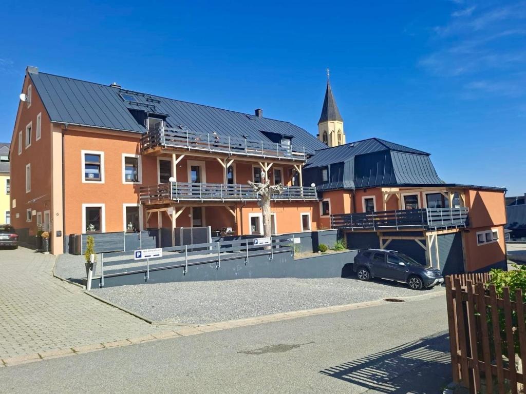 a large building with a church on top of it at Fewos4seasons in Kurort Oberwiesenthal