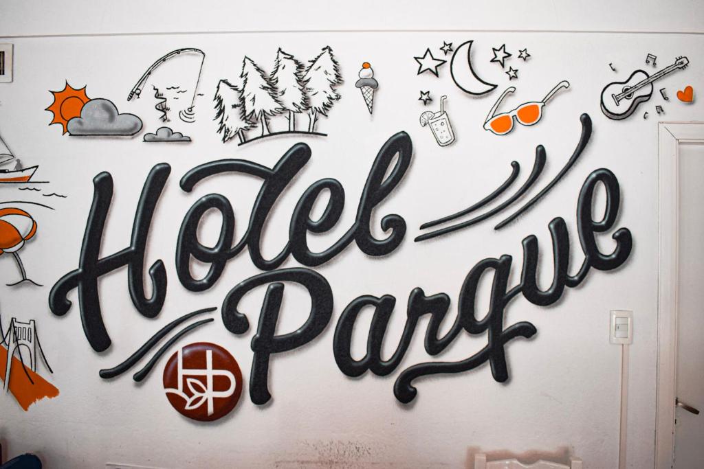 a wall with a sign that reads hotel party at Hotel Parque in Necochea