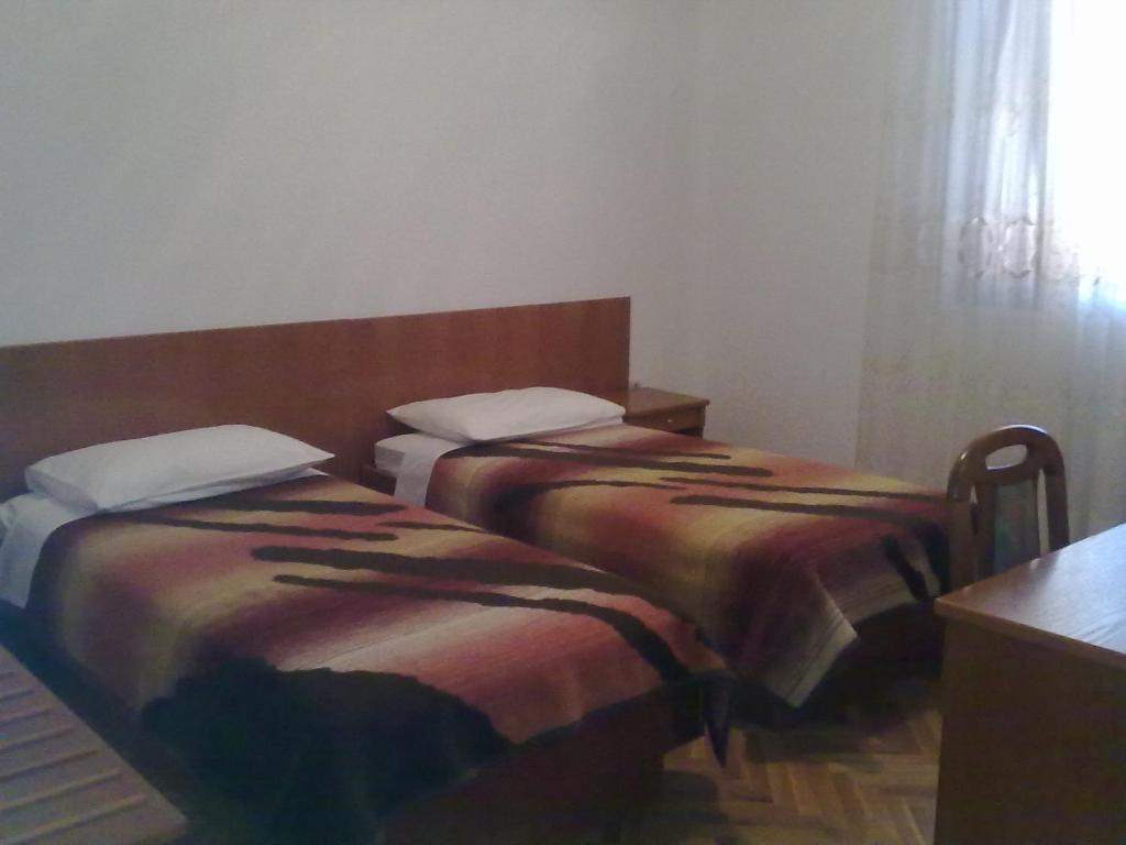 Postel nebo postele na pokoji v ubytování Apartmani Ždrelac