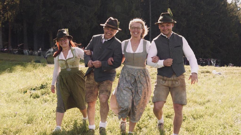 a group of people wearing cowboy hats walking in a field at Bauer & Wirt Langthaler in Emmersdorf an der Donau