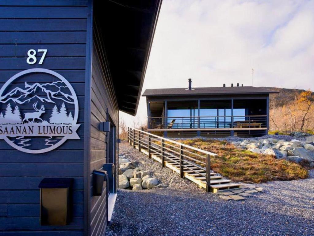 a building with a sign on the side of it at Holiday Home Saanan lumous by Interhome in Kilpisjärvi
