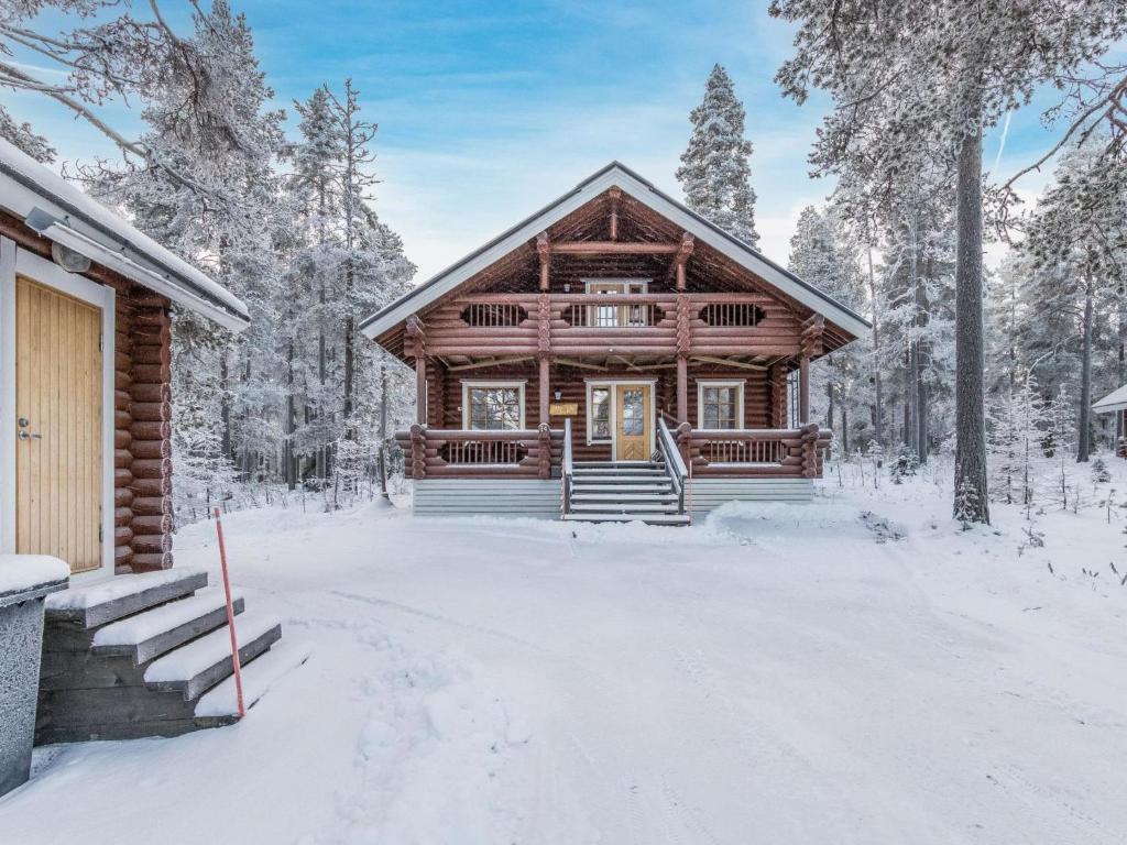 a log cabin in the woods in the snow at Holiday Home Lompakko by Interhome in Äkäslompolo