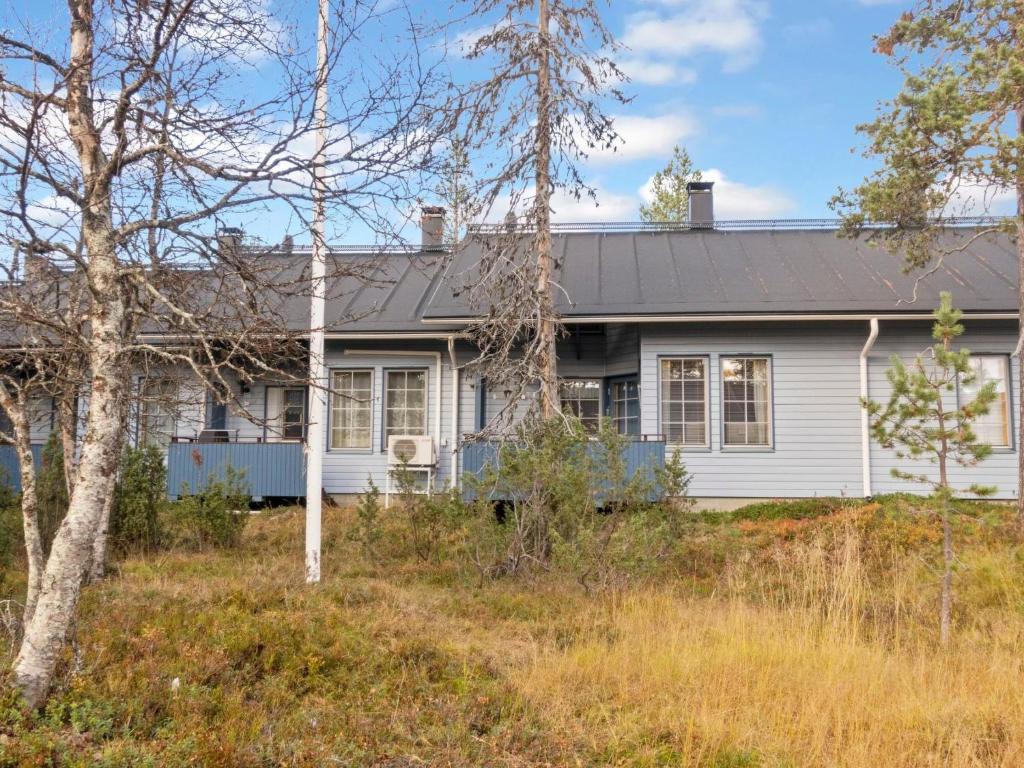 a white house with a black roof at Holiday Home Siulapalkinen a 4 by Interhome in Saariselka
