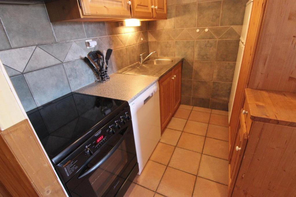 Kuchyň nebo kuchyňský kout v ubytování Balcons Appartements VTI