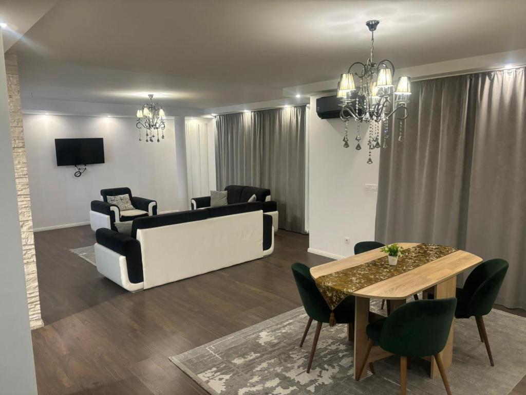 a living room with a couch and a table at Apartmen Emina in SJJ