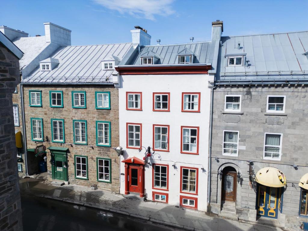 a group of buildings next to a river at Le Cavalier du Moulin - M11 in Quebec City