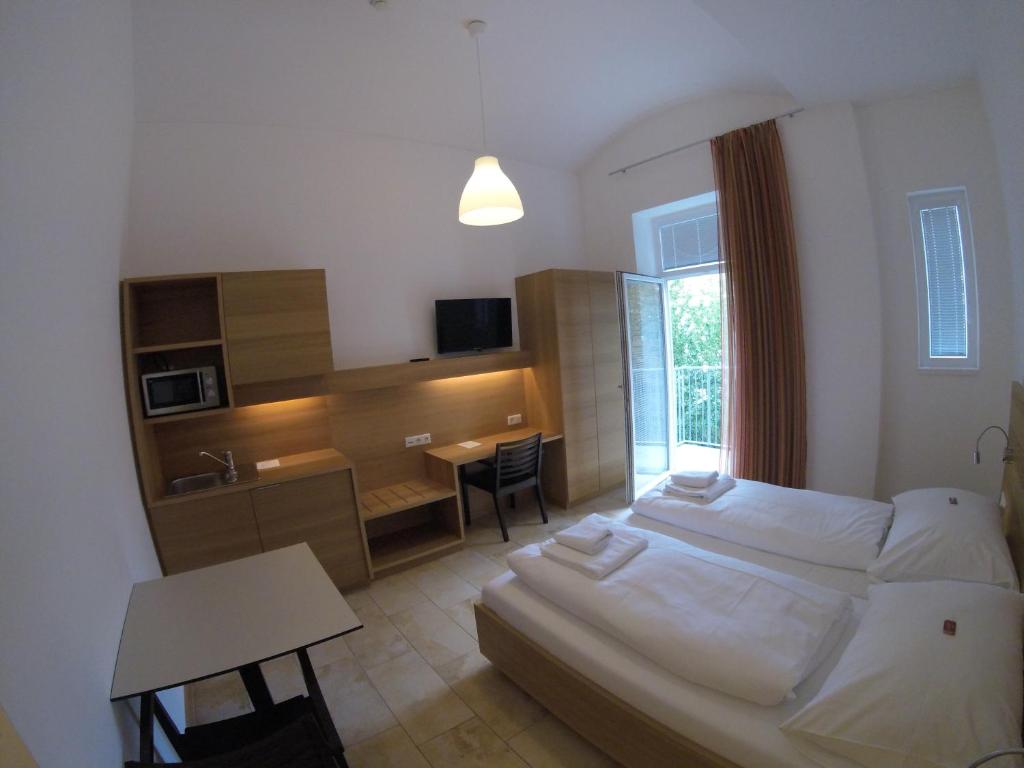Postel nebo postele na pokoji v ubytování Hotel Aton