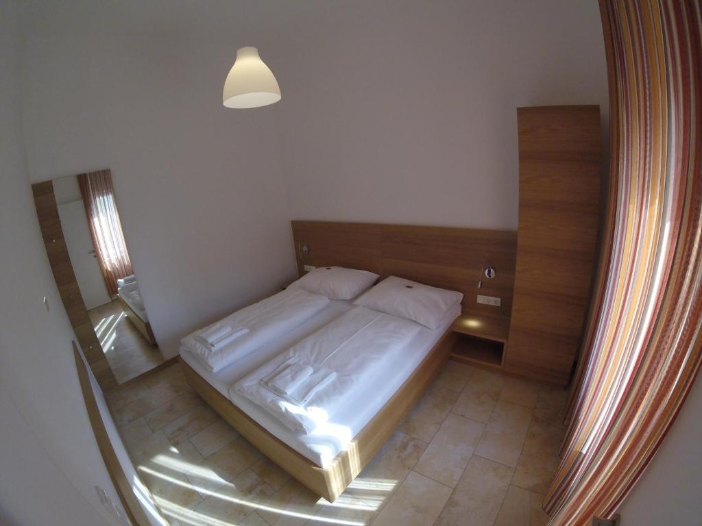 Postel nebo postele na pokoji v ubytování Hotel Aton