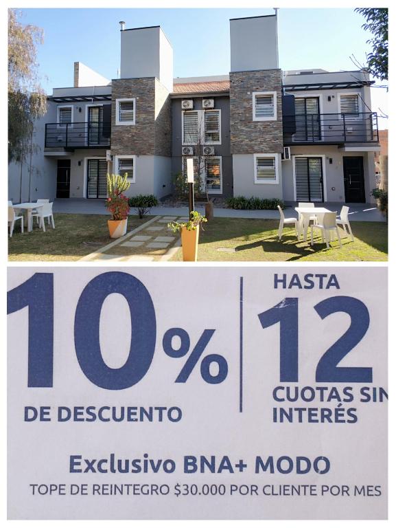 a house for sale with a sign in front of it at Complejo Entre Marte y La Luna in Merlo