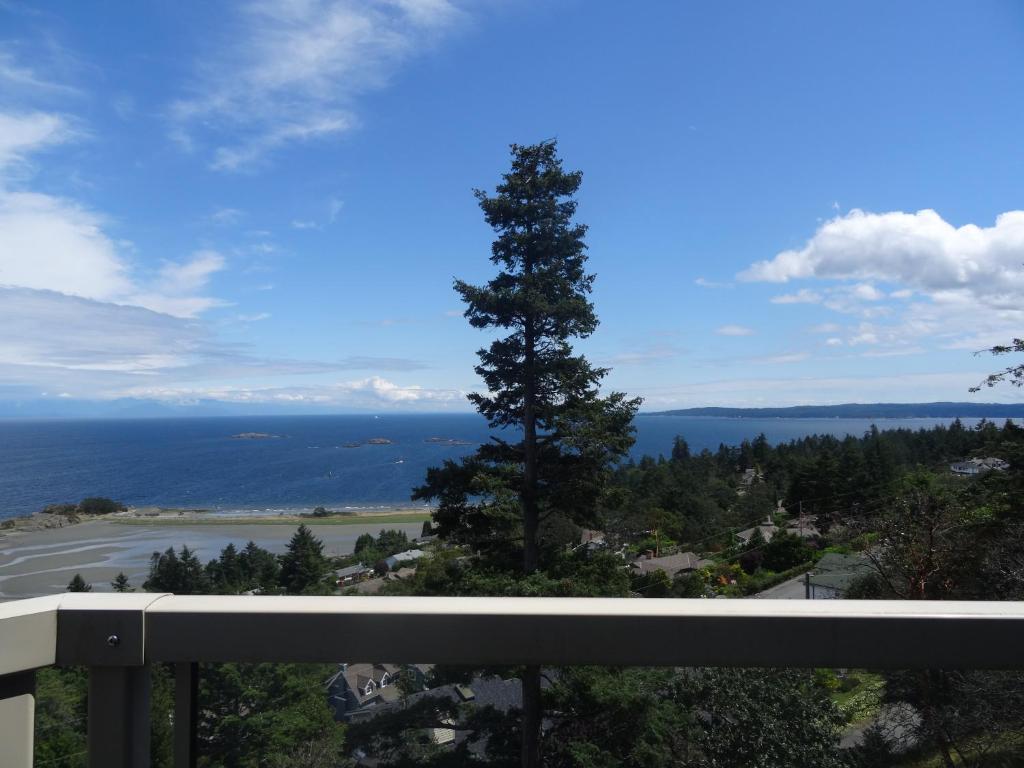 a view of the ocean from the balcony of a house at Gibralter Rock Ocean View B&B in Nanaimo
