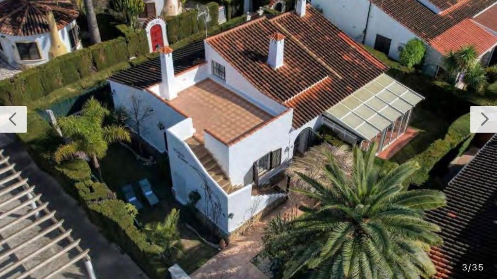 an aerial view of a house with a roof at La casilla de Miguel con jardín privado y piscinas in Denia