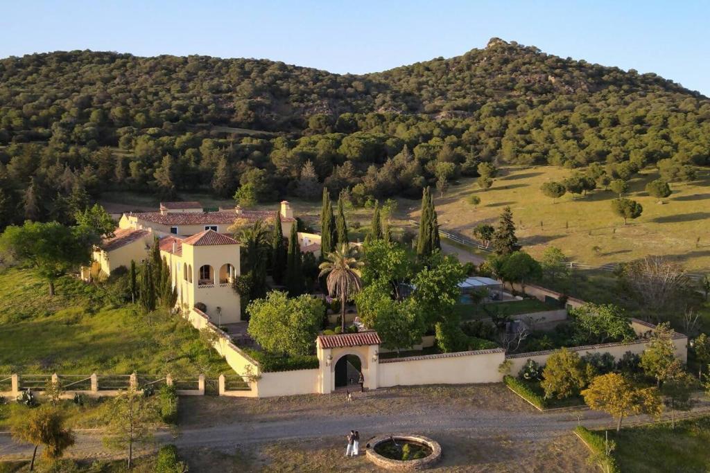 an aerial view of a house on a hill at Finca La Alcolehuela in Santa Elena