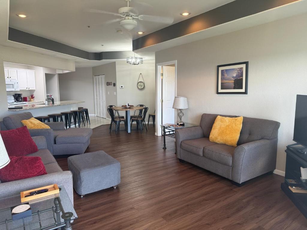 a living room with a couch and chairs and a table at Lake Ozarks Get Away in Lake Ozark