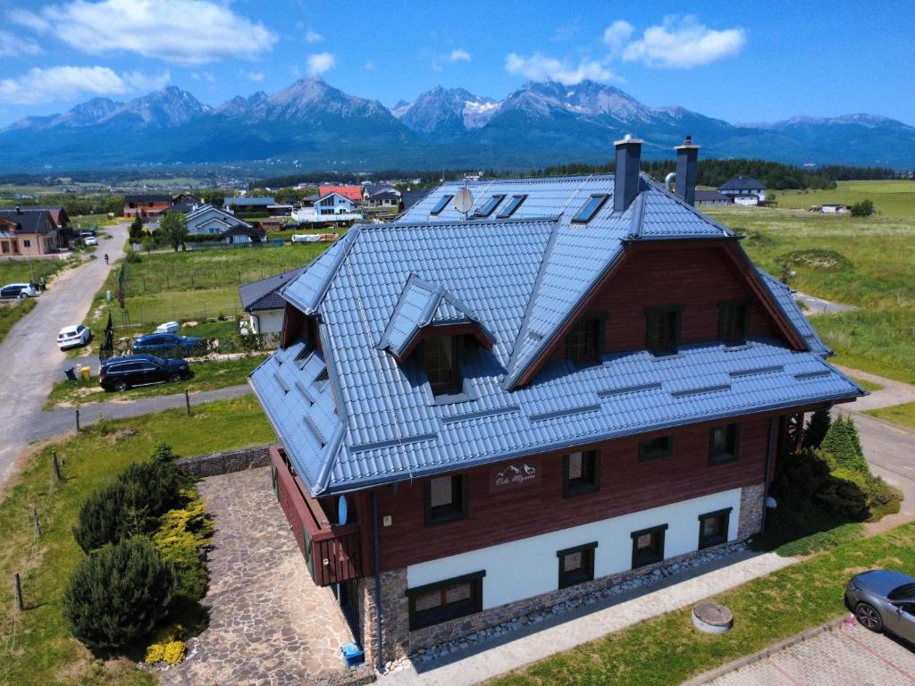 an overhead view of a house with a metal roof at Vila Araya Mlynica in Mlynica