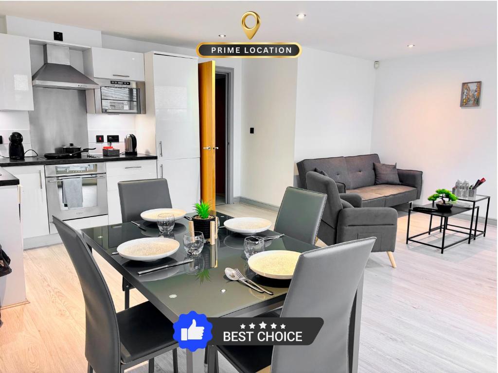 a kitchen and living room with a table and chairs at Modern 2 Bed Apartment in York City Centre - Best York Location - Steps from Top Attractions in York