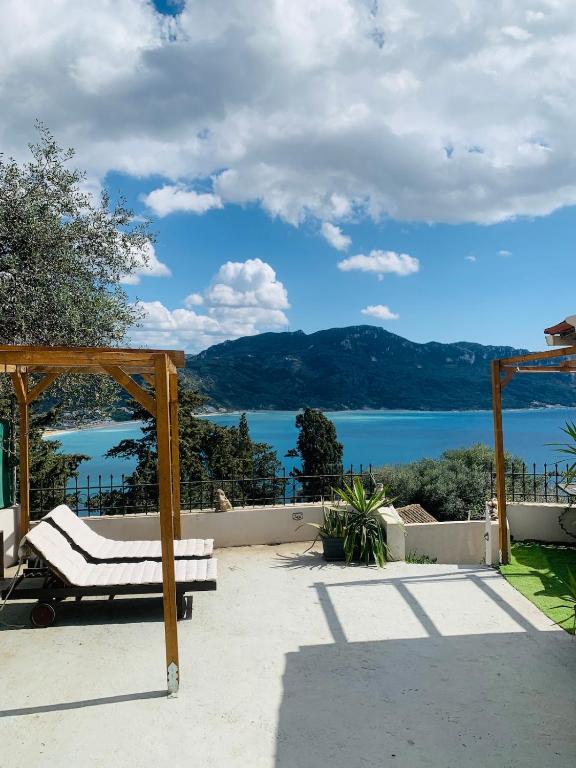 a patio with a view of the water at Vita vi in Afionas