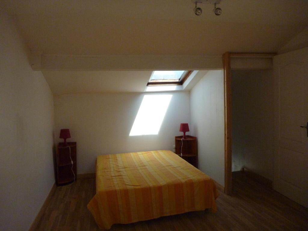 Postel nebo postele na pokoji v ubytování Le Surplage