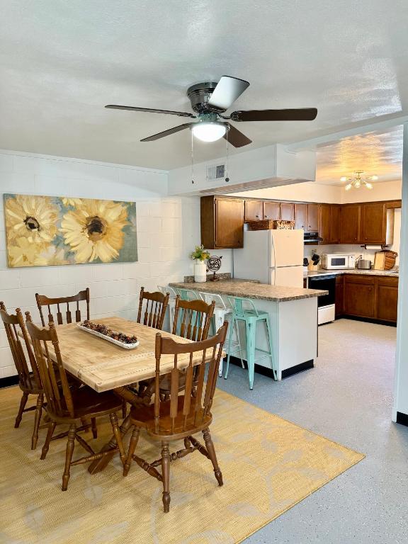 a kitchen with a table and chairs in a room at 4th Street Residences in Saint David