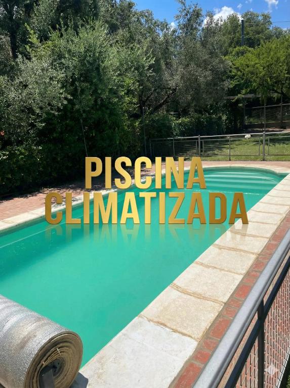 a swimming pool in a villa with aiterraneaniterraneaniterraneaniterraneaniterraneaniterraneaniterranean at Cabañas La Belen in Merlo