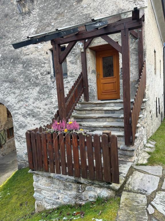 a house with a wooden door and a wooden fence at Apartment Obervellach in Obervellach